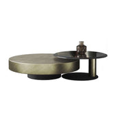 Set of two gold and black round nesting coffee tables with tempered glass tops